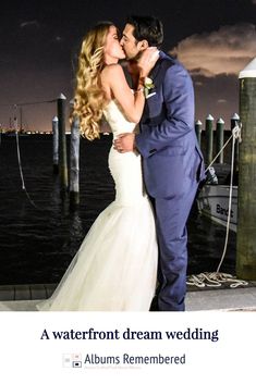 a bride and groom kissing in front of the water at their wedding reception with text that reads, a waterfront dream wedding