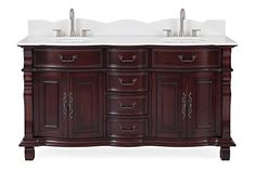 a double sink vanity with two white sinks and dark wood cabinetry on both sides