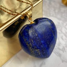 Luxury Lapis Lazuli Heart pendant featuring 18k gold filled 'star' chain over sterling silver. A deep blue stone from Afghanistan. This stone has the powers to heal and build any relationship! Comes in branded gift box and postcards. A great gift for those who want to show some attention and love to the recipient. 🌀The benefits of wearing LAPIS LAZULI jewelry: ➜ Lapis Lazuli stones are believed to help bring about harmony in relationships. ➜This is also a stone of sincerity and purity. It offer Empathy Abilities, Spiritual Pendant Necklace For Anniversary Gift, Blue Heart Necklace, Necklace Luxury, Lapis Lazuli Jewelry, Star Chain, Silver Anniversary, Lapis Lazuli Stone, Premium Packaging