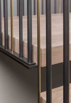 a close up view of some metal and wood railings