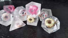 several different shapes and sizes of donuts in plastic packaging