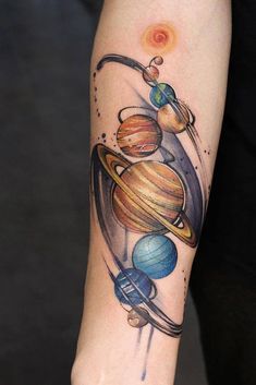 an arm tattoo with planets on it