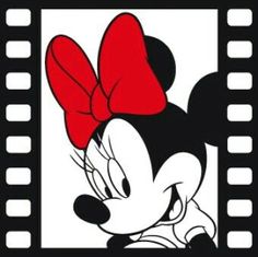 a mickey mouse with a red bow on it's head in front of a film strip