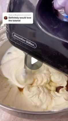 a mixer mixing batter in a bowl with the words, definitely would love the video