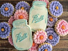 decorated cookies in the shape of mason jars and flowers