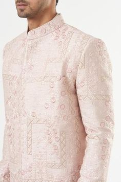 Blush pink sherwani in silk base with floral embroidery. Comes with a pant. - Aza Fashions Pink Bandhgala With Resham Embroidery For Eid, Traditional Pink Bandhgala With Resham Embroidery, Pink Bandhgala With Resham Embroidery For Festive Occasions, Pink Bandhgala With Chikankari Embroidery For Eid, Pink Bandhgala With Chikankari Embroidery For Festive Occasions, Fitted Pink Bandhgala With Zari Work, Fitted Pink Sherwani For Reception, Pink Raw Silk Sherwani With Traditional Drape, Fitted Pink Sherwani With Chikankari Embroidery