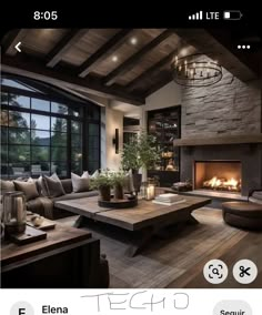 a living room filled with furniture and a fire place in the middle of it's walls