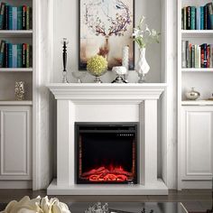 a living room with a fire place and bookshelves