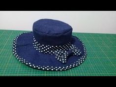 a blue hat with white polka dots on it