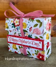 a mother's day gift box with flowers on it