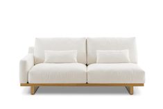 a white couch sitting on top of a wooden frame