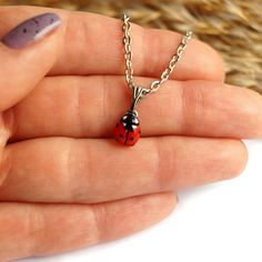 This miniature necklace with a ladybug is made and painted by hand. The size of the ladybug is about 8 mm (0.3 in), The length of the necklace is adjustable from 16 to 19 inches, Materials: polymer clay, metal chain. ♥ Ladybug Stud Earrings https://www.etsy.com/listing/583555073 ♥ Ladybug Ring https://www.etsy.com/listing/661389811  Other necklaces you can see here: https://www.etsy.com/shop/RinaStudioDesign?section_id=24005632 * Submersion in water is not recommended for polymer clay as this will quickly deteriorate the product. It is recommended that you remove the necklace prior to swimming or showering to extend the life of the product. * Please, note that given the varying monitor settings, the colours displayed on your screen might differ slightly from the real ones. * All items are Ladybug Ring, Ladybug Necklace, Jewelry Valentines Day, Nose Ring Jewelry, Petite Jewelry, The Ladybug, A Ladybug, Tiny Pendant, Bear Outfits