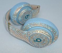 the headphones are decorated with swarong crystals