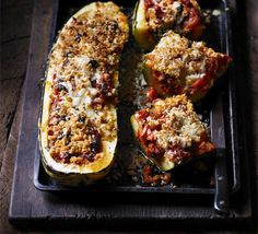 stuffed eggplant with sauce and parmesan cheese on a baking tray, ready to be eaten