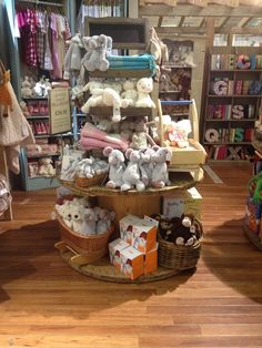 stuffed animals are stacked on top of each other in a toy store's display