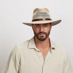 Florence | Mens Wide Brim Straw Sun Hat combines style and functionality for excellent sun protection. Made from vented canvas and cotton fabric, this hat features a faux leather band with a concho and chin cord, perfect for men seeking a breathable, rugged hat for sunny days. Material: Vented Canvas/Cotton Fabric Shape: Outback Trim: Faux Leather Band Embossed with Pattern, with Side Concho Brim Size: 3 1/4" Crown Height: 4 1/4" Feature: Adjustable Chin Cord Sweatband: Elastic Sweatband Importe Panama Hat Style, American Hat Makers, Straw Sun Hat, Hat Style, Crown Design, Wide Brimmed, Sun Hat, Leather Band, Hat Fashion