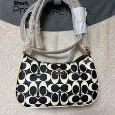 Brand New Coach Teri Black And White Bag! Number Cq674 Measurements Length: 9.5" Height: 6.0" Width: 3.0" Materials Signature Coated Canvas And Smooth Leather Fabric Lining Handle Detachable Handle With 8.25" Drop Strap Detachable Strap With 22.75" Drop For Shoulder Or Crossbr Wear Features Zip-Top Closure Inside Multifunction Pocket Two Credit Card Slots Black And White Bags, Leather Fabric, White Bag, Zip Top, Coach Bags, Smooth Leather, Card Slots, Slots, Credit Card