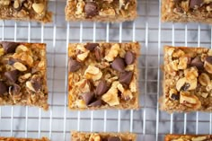 several squares of granola bars cooling on a rack