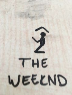 the sign is written in black ink on a piece of wood that says, the weekend