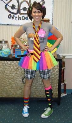 a woman wearing a tie and colorful skirt