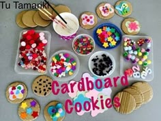 there are many decorated cookies on the table with words that read card board cookie's