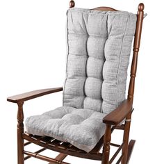 a wooden rocking chair with grey cushions