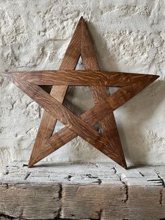 a wooden star hanging on the wall