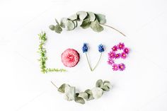 the word love spelled out with flowers and leaves