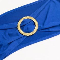 Royal Blue Stretch Chair Sashes Royal Blue Stretch Chair Sashes Elevate your event decor to a realm of majestic elegance with our Royal Blue Spandex Stretch Chair Sash Bands, adorned with opulent Gold Diamond Ring Slide Buckles. These chair sash bands are not just accessories; they are a symbol of your dedication to style and meticulous attention to detail. Crafted from premium spandex material, these sashes are renowned for their durability and remarkable flexibility, ensuring a secure and snug Royal Blue Ring Bearer Pillow, Chair Bands, Royal Ball, Chair Sash, Chair Sashes, Gold Rhinestone, Slide On, Gold Diamond Rings, Event Decor