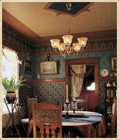 an old fashioned dining room with blue walls