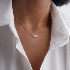 Embrace heavenly elegance with our Angel Wing Necklace--a symbol of grace and protection. This delicately made up accessory features a stunning angel wing pendant, radiating timeless charm. Meticulously designed with high-quality materials, the necklace seamlessly combines durability with a touch of celestial style. Perfect for everyday wear, this piece adds a meaningful and fashionable flair to your ensemble. Elevate your look and carry the essence of divine inspiration with the Angel Wing Neck Celestial Style, Angel Wings Necklace, Diamond Angel, Wings Necklace, Wing Jewelry, Angel Wing Necklace, Angel Wing Pendant, Necklace Diamond, Wing Necklace