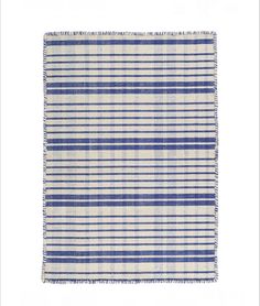 a blue and white striped rug with fringes on the edges, against a white background