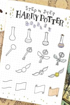 a notebook with harry potter symbols on the cover and some other things drawn in it