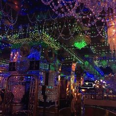 a room filled with lots of lights and chandeliers