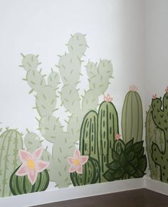 two cactus wallpapers with pink flowers and green leaves on the wall next to each other