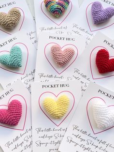 small crocheted hearts are displayed on cards