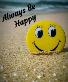 a smiley face on the sand with words always be happy