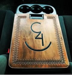 a wooden sign with the number twenty four on it's side in a car