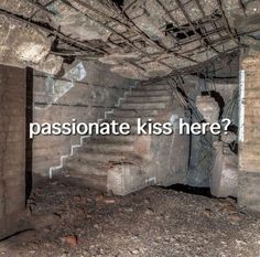 an abandoned building with the words passionate kiss here written in front of it and stairs leading up to the second floor