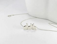 Discover elegance with our Bunny Necklace Collection! 🐰 Adorned with charming rabbit motifs, these exquisite pieces are crafted in silver and gold, featuring delicate gemstones for added allure. Perfect for Easter or any occasion, these handcrafted necklaces make the ideal gift! Shop now and embrace the beauty of nature-inspired jewelry. 🌿 #BunnyNecklace #EasterJewelry #GiftIdeas" Three bunny mix together. Just like the special bond you share as sisters. :) This is such a lovely keepsake for your best friends to cherish forever! This simple, romantic , beautiful three metal necklace would make a great 3 sisters gift ,sisters present,special day gift for three daughters, gift for three girls,,bridesmaid gifts ,present for teen girl,bridesmaids jewelry, birthday gift. Best for causal neckl Best Friends Jewelry, Sisters Necklace, Bunny Jewelry, Friends Jewelry, Lover Necklace, 3 Best Friends, Bunny Necklace, Bridesmaids Jewelry, Easter Jewelry