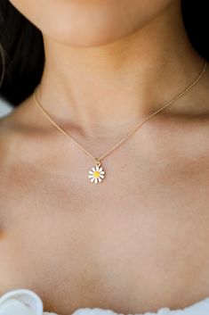 Finish any 'fit in iconic style when you add the Kenna Gold Daisy Charm Necklace! This cute necklace features a simple gold chain with a white daisy charm on the end. Style the Kenna Necklace with any outfit to instantly upgrade your look! Gold Plated White Daisy Charm Lobster Clasp + Extender One Size | Length 8” + 3" Extender Blue Dress Accessories, Simple Gold Chain, Cute Necklaces, Daisy Charm, Daisy Necklace, Necklace Cute, Upgrade Your Look, White Daisy, Cute Necklace