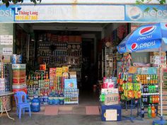 a pepsi shop with an umbrella over the entrance