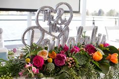 the table is decorated with flowers and sparkles