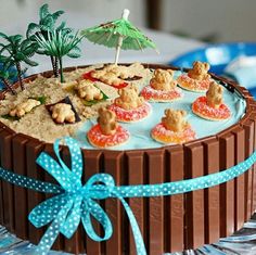 a chocolate cake decorated with cookies and palm trees