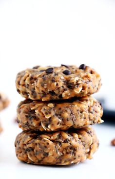 three cookies stacked on top of each other with chocolate chips and oats in the middle