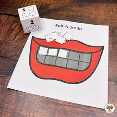 a piece of paper that has been cut out to look like a mouth with the word real - a - smile on it