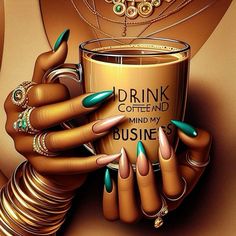 a woman's hand holding a coffee cup with green fingernails and rings on it