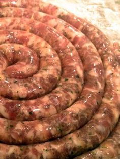 several sausages are stacked together in a spiral pattern