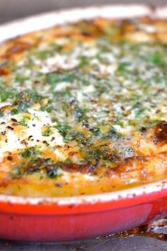 a casserole dish with broccoli and cheese