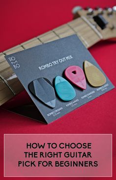 the guitar picker is being used to pick up picks for beginner's guitars